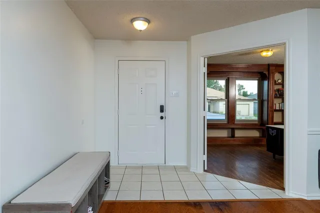 a view of kitchen with a sink and a refrigerator
