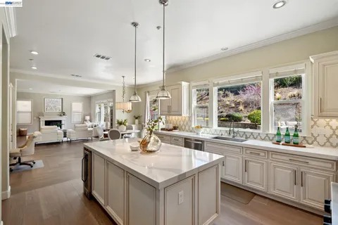 a kitchen with a stove and cabinets