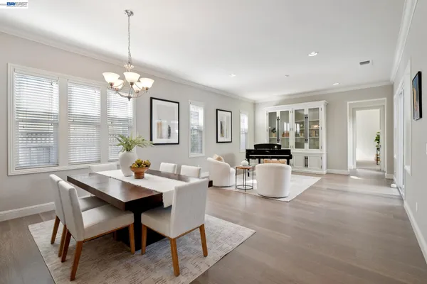 a living room with furniture a window and a table