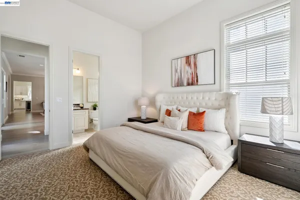 a bathroom with a granite countertop sink a mirror a bathtub and shower