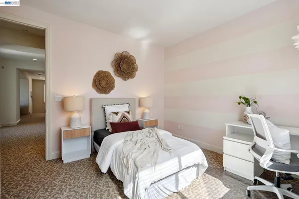 a bed room with a bed and a chair