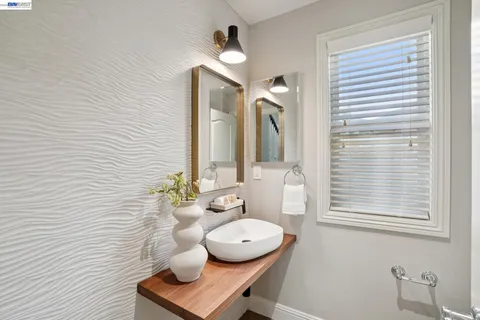 a utility room with sink dryer and washer