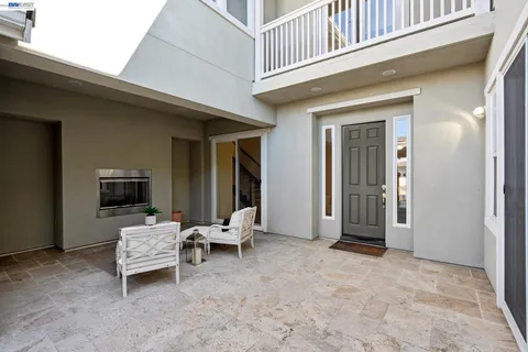 front view of a house with a bench