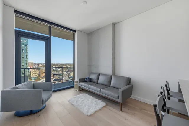 a living room with furniture and a window