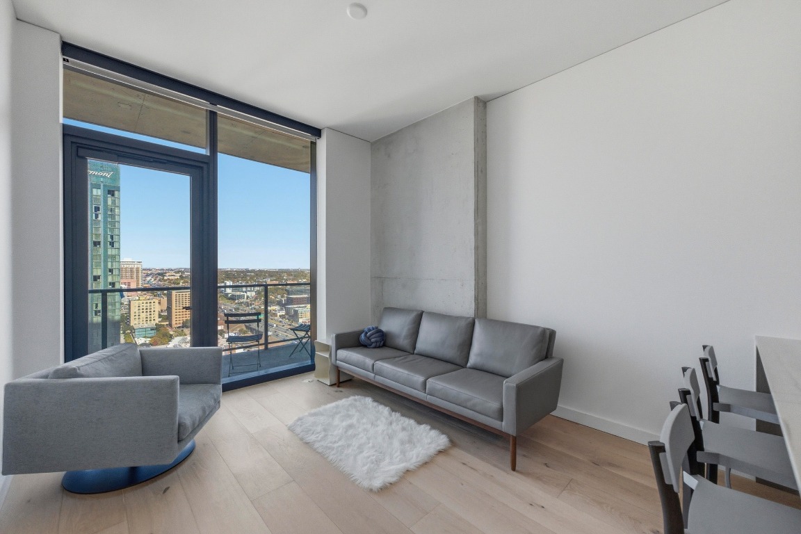 a living room with furniture and a window
