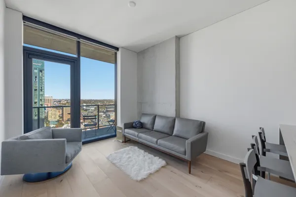 a living room with furniture and a window