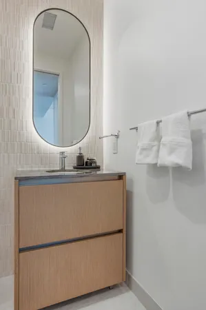 a bathroom with a sink and mirror
