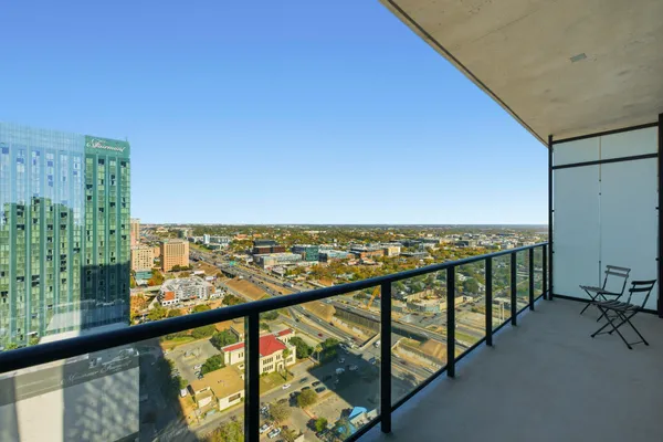 a view of a city skyline from a balcony
