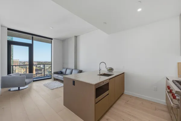 a view of a room with a sink and couch