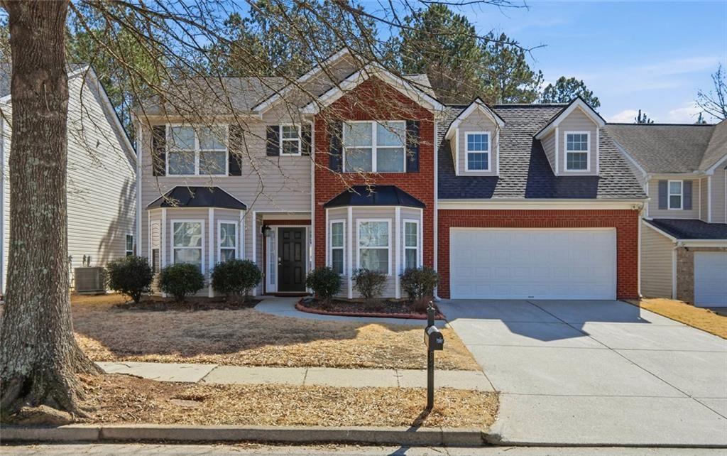 3570 Bogan Mill Road Northeast Buford, GA 30519 - Photo 3 of 31 a front view of a house with a yard