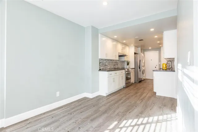 a view of kitchen with wooden floor