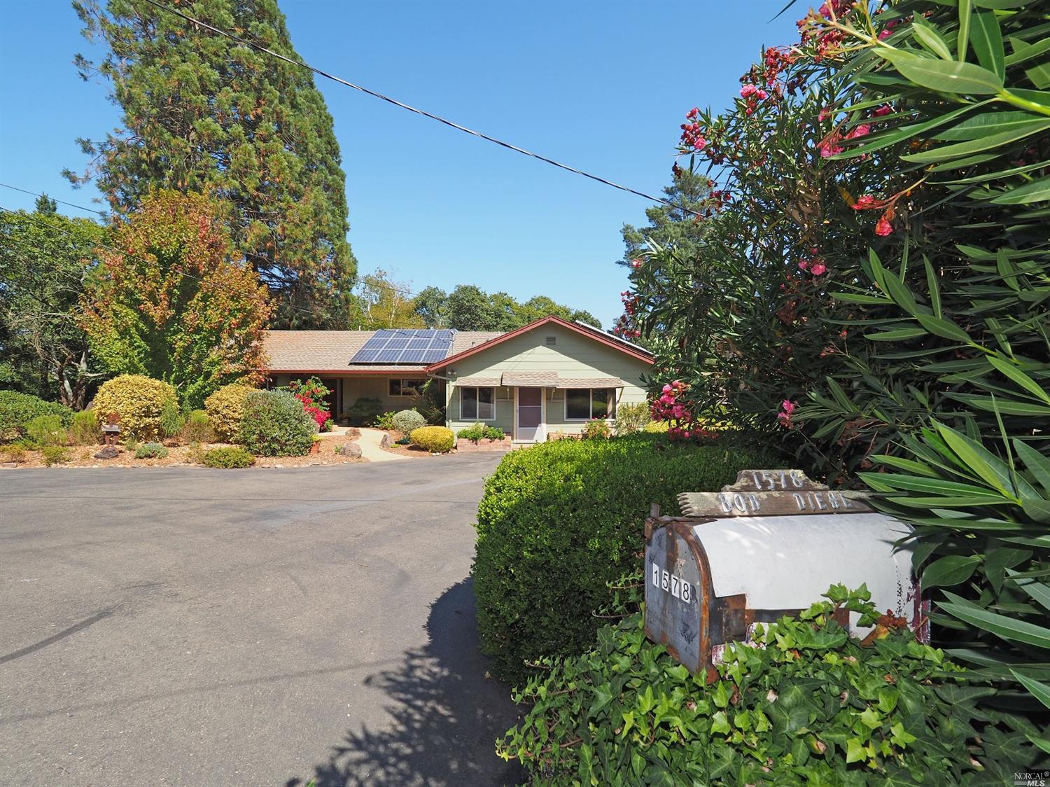 1578 Frank Road Sebastopol, CA 95472 - Photo 1 of 1 a front view of a house with a yard and garage