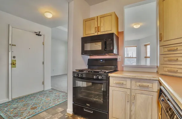 a view of bathroom with utility room and washer