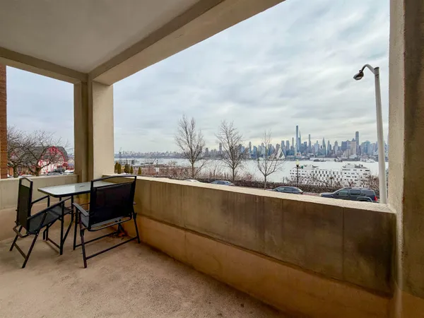 a view of balcony with furniture
