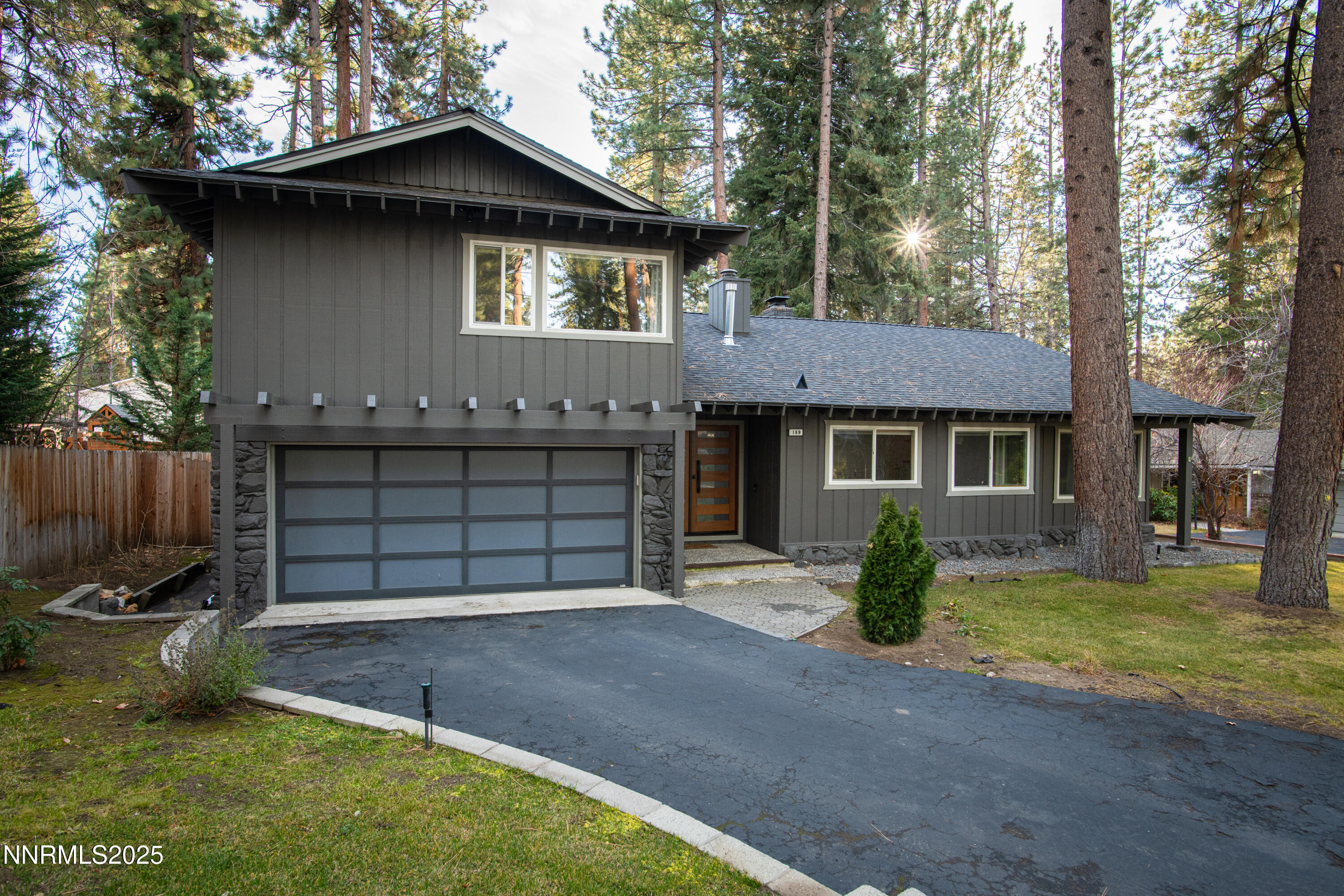 189 Ray Way Zephyr Cove, NV 89448 - Photo 2 of 36 a front view of a house with a yard and garage