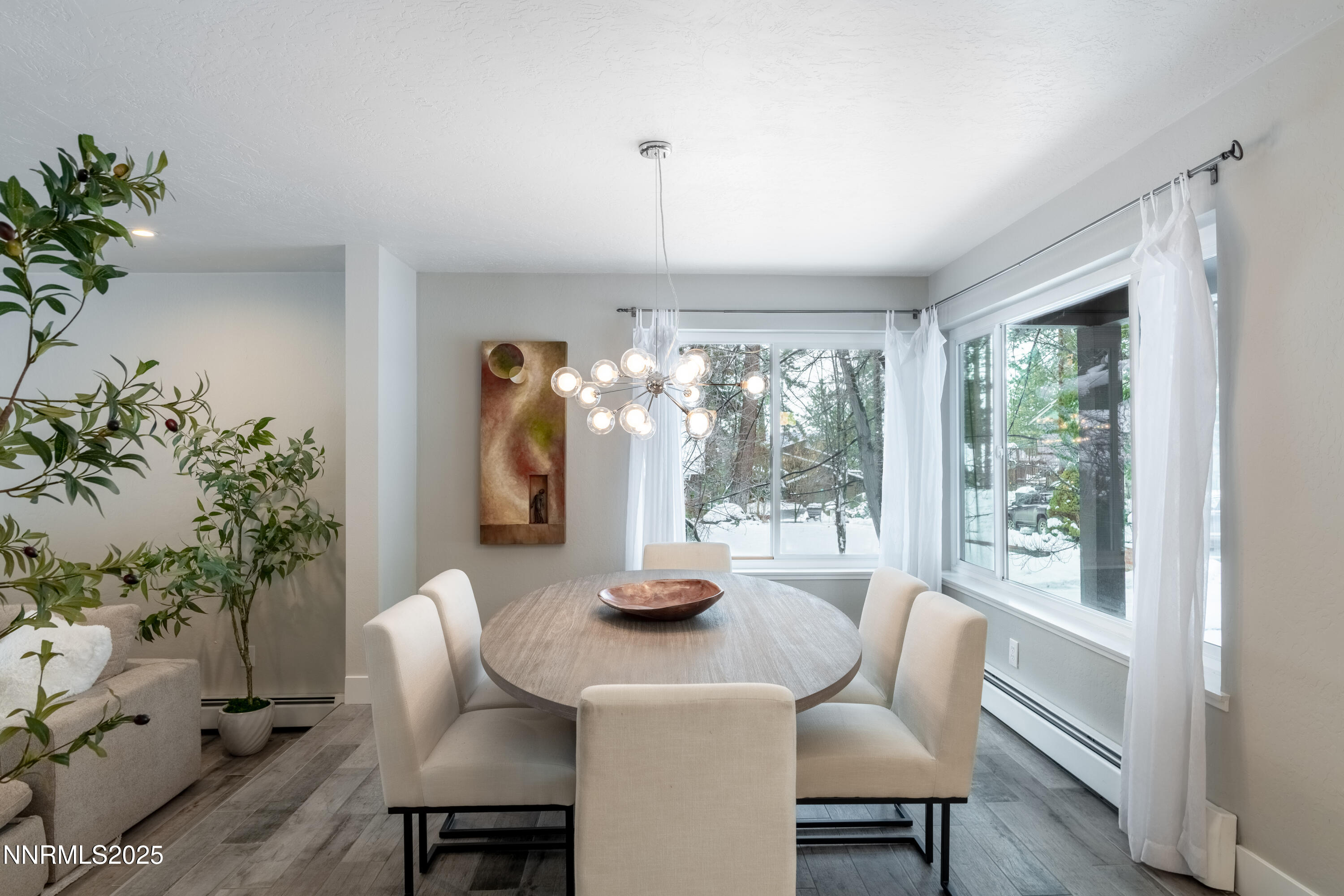 189 Ray Way Zephyr Cove, NV 89448 - Photo 25 of 36 a dining room with furniture window and wooden floor