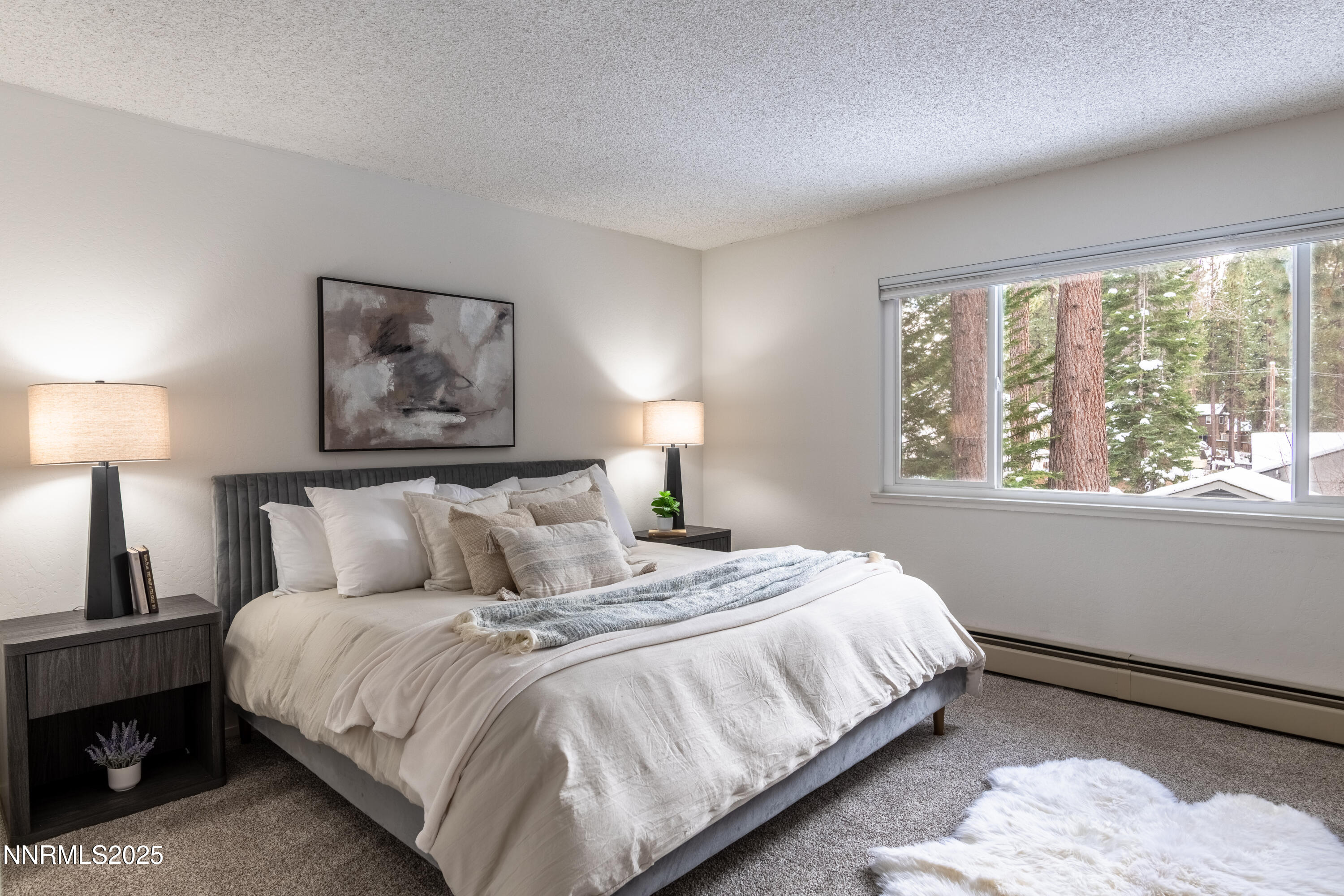 189 Ray Way Zephyr Cove, NV 89448 - Photo 28 of 36 a bedroom with a bed and a night stand