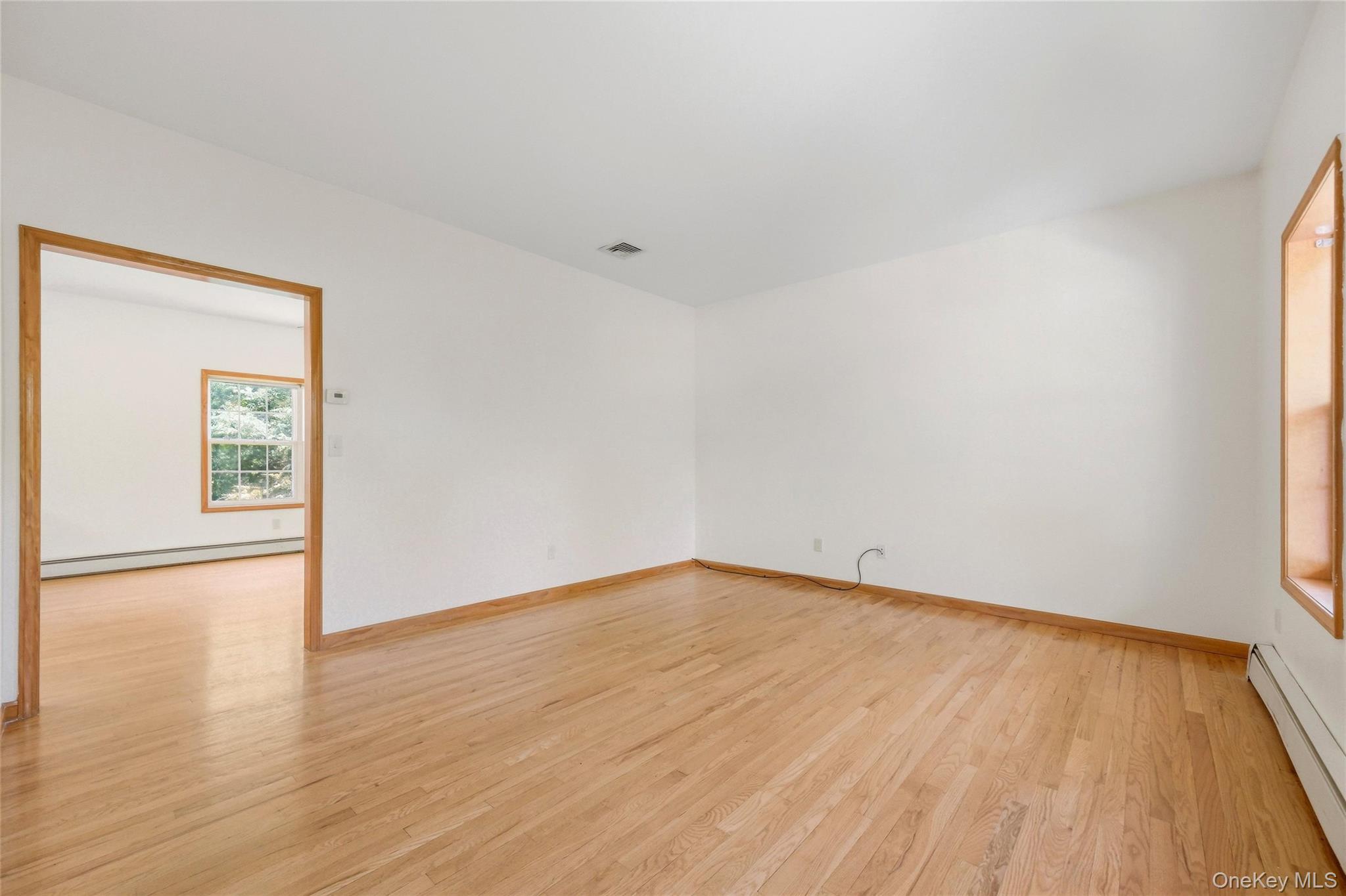 5 Horton Road Washingtonville, NY 10992 - Photo 6 of 42 a view of an empty room with wooden floor and a window