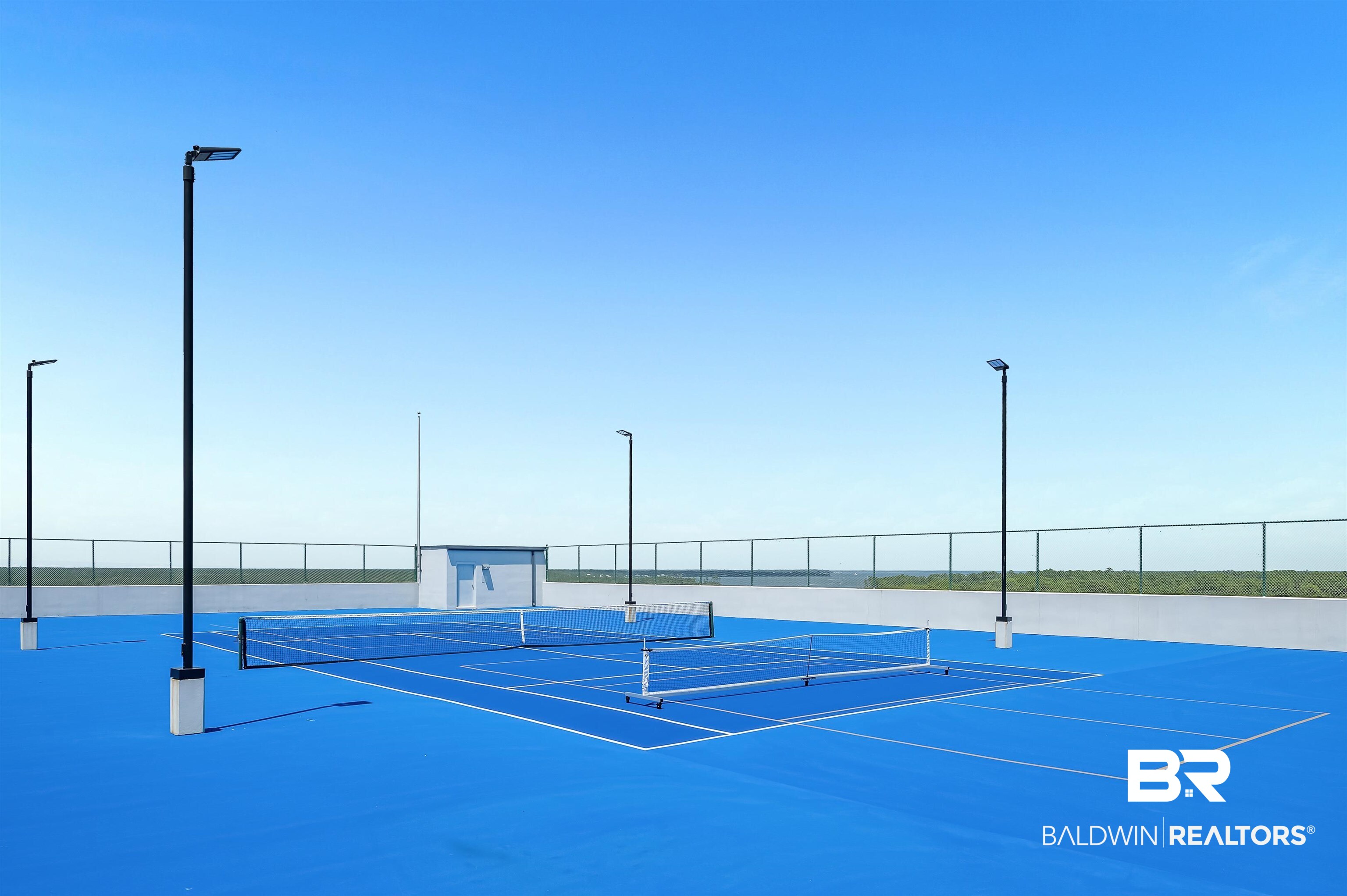27582 Canal Road, Unit 2507 Orange Beach, AL 36561 - Photo 73 of 75 View of tennis court with community basketball court
