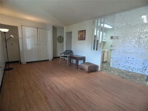 a view of a livingroom with furniture and wooden floor