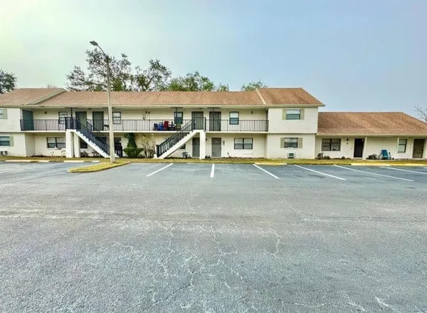 a view of multiple houses with a yard