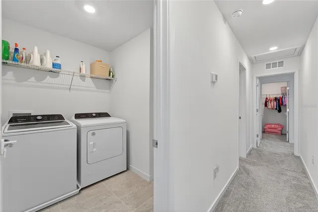 a bedroom with a large bed and a tv