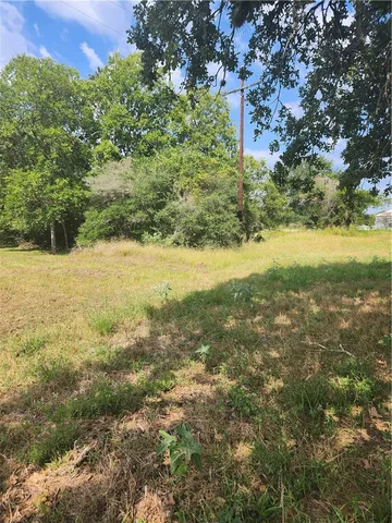 a view of beach and yard