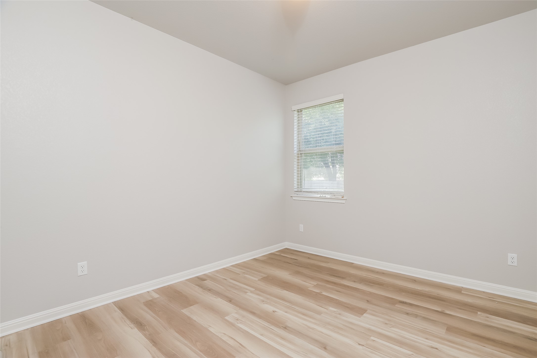 2724 Juniper Woods Road Leander, TX 78641 - Photo 15 of 21 A well-lit room with resilient plank flooring and natural light through the window.