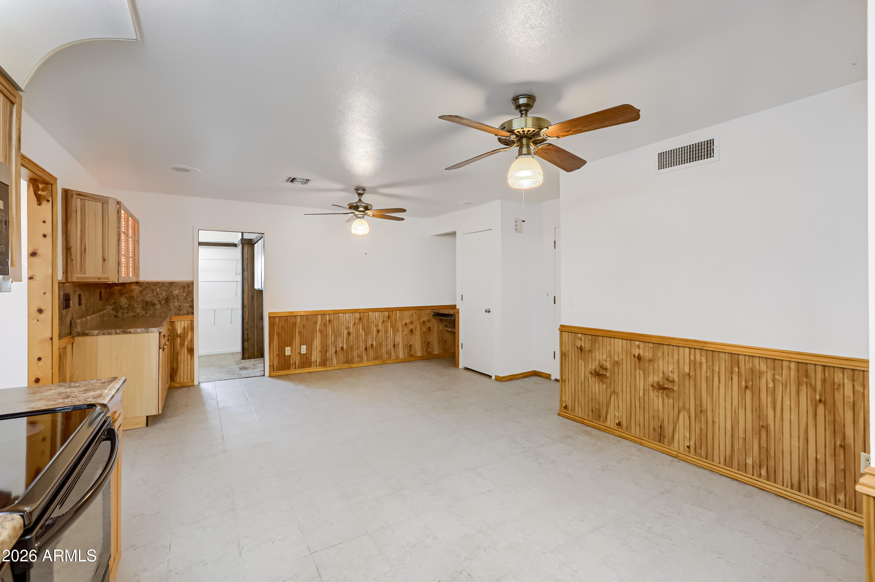 3823 West Greenway Road Phoenix, AZ 85053 - Photo 10 of 28 a view of a livingroom with furniture and a ceiling fan