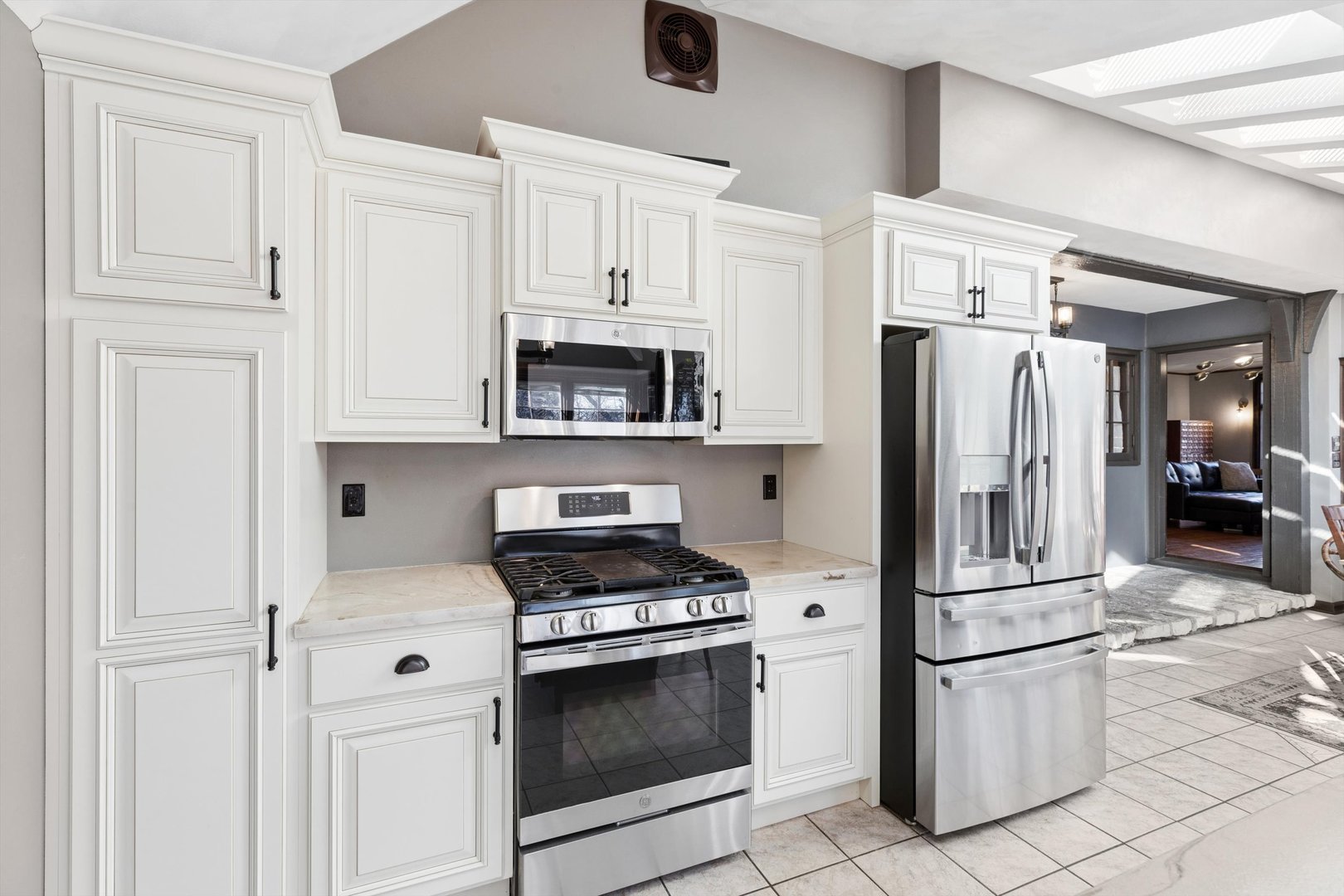 716 Terrace Drive Clinton, IA 52732 - Photo 34 of 78 a kitchen with stainless steel appliances a refrigerator a stove a microwave and cabinets
