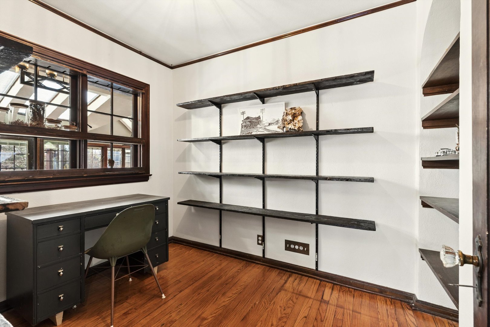 716 Terrace Drive Clinton, IA 52732 - Photo 49 of 78 a view of a room with shelves and wooden floor