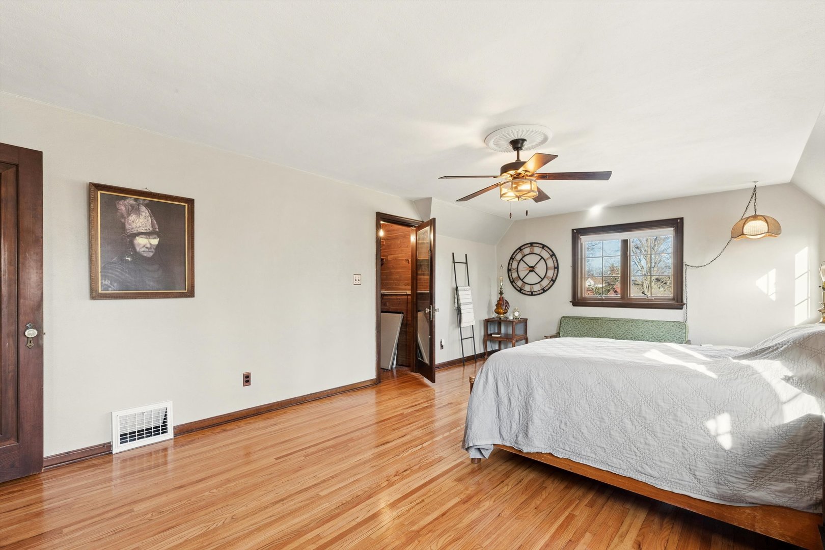 716 Terrace Drive Clinton, IA 52732 - Photo 53 of 78 a bedroom with a bed mirror and a window