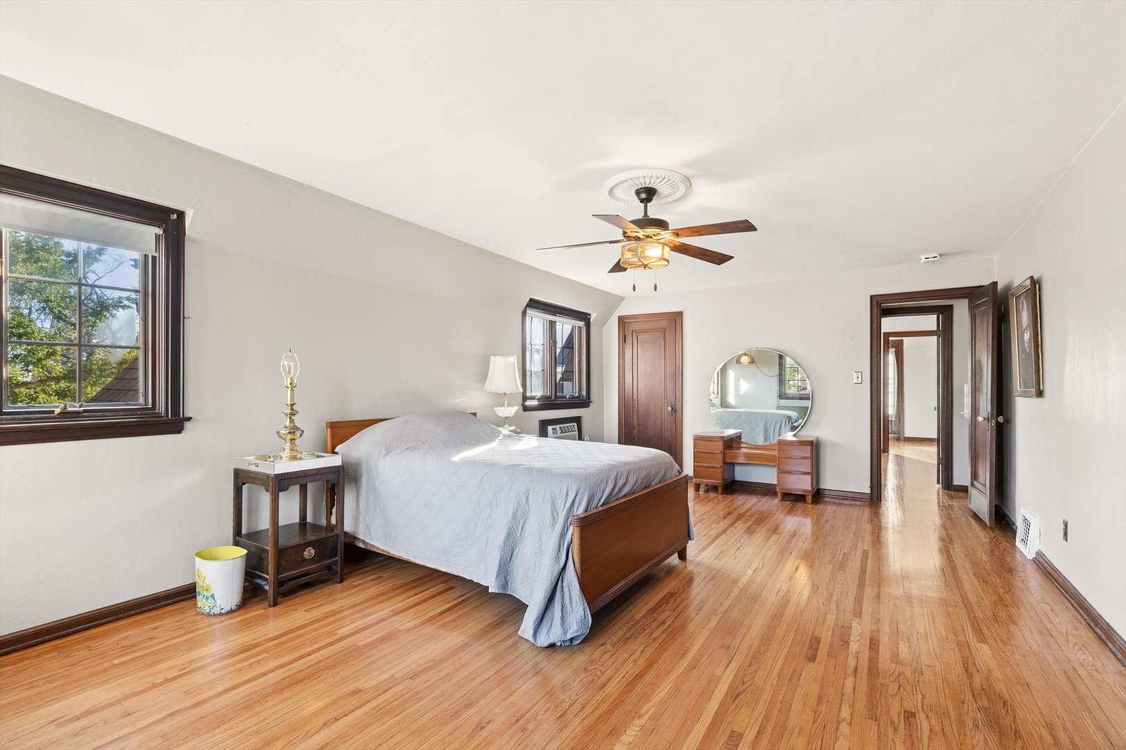 716 Terrace Drive Clinton, IA 52732 - Photo 54 of 78 a spacious bedroom with a bed and wooden floor