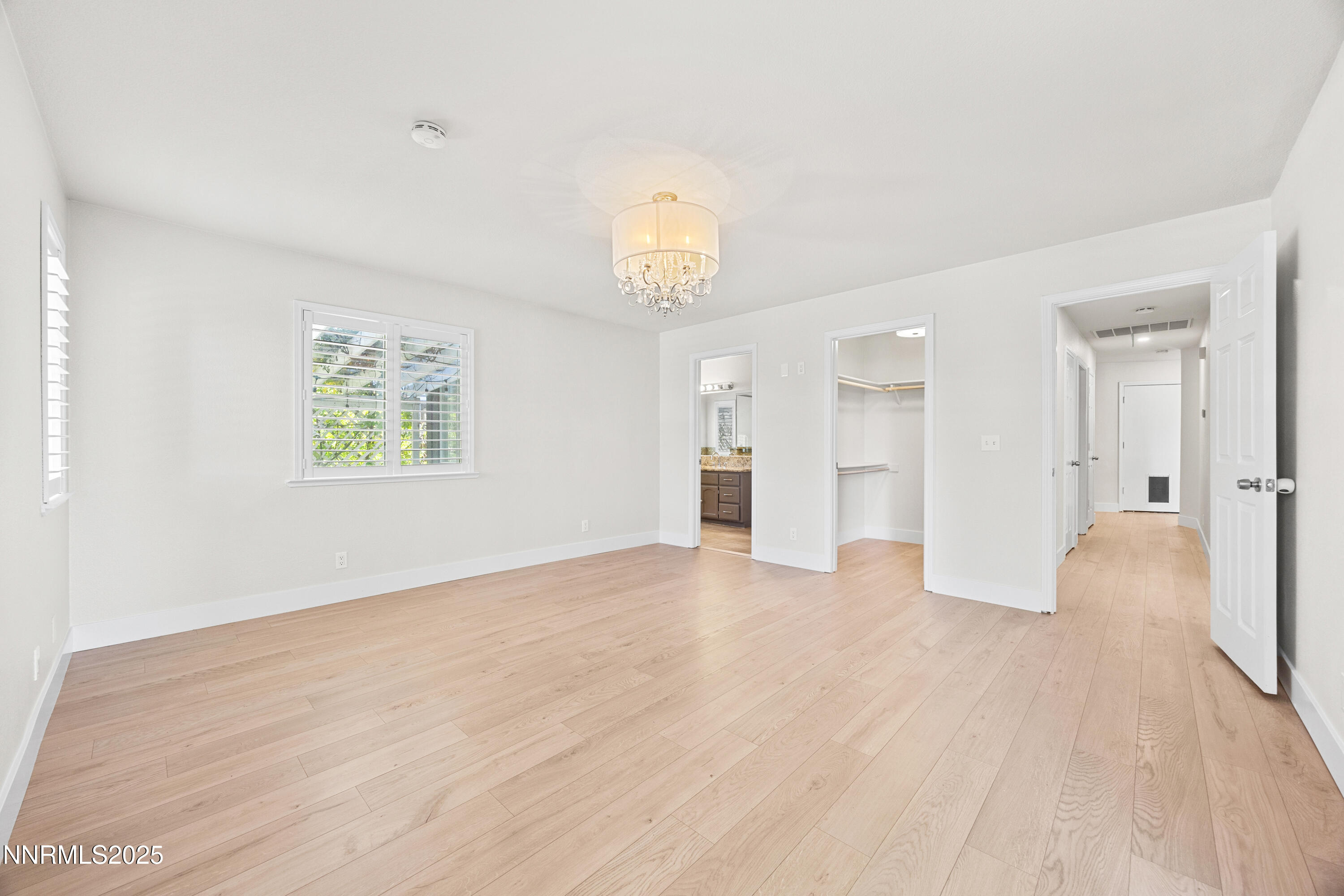 3510 Comstock Drive Reno, NV 89512 - Photo 16 of 37 a view of empty room with wooden floor and windows
