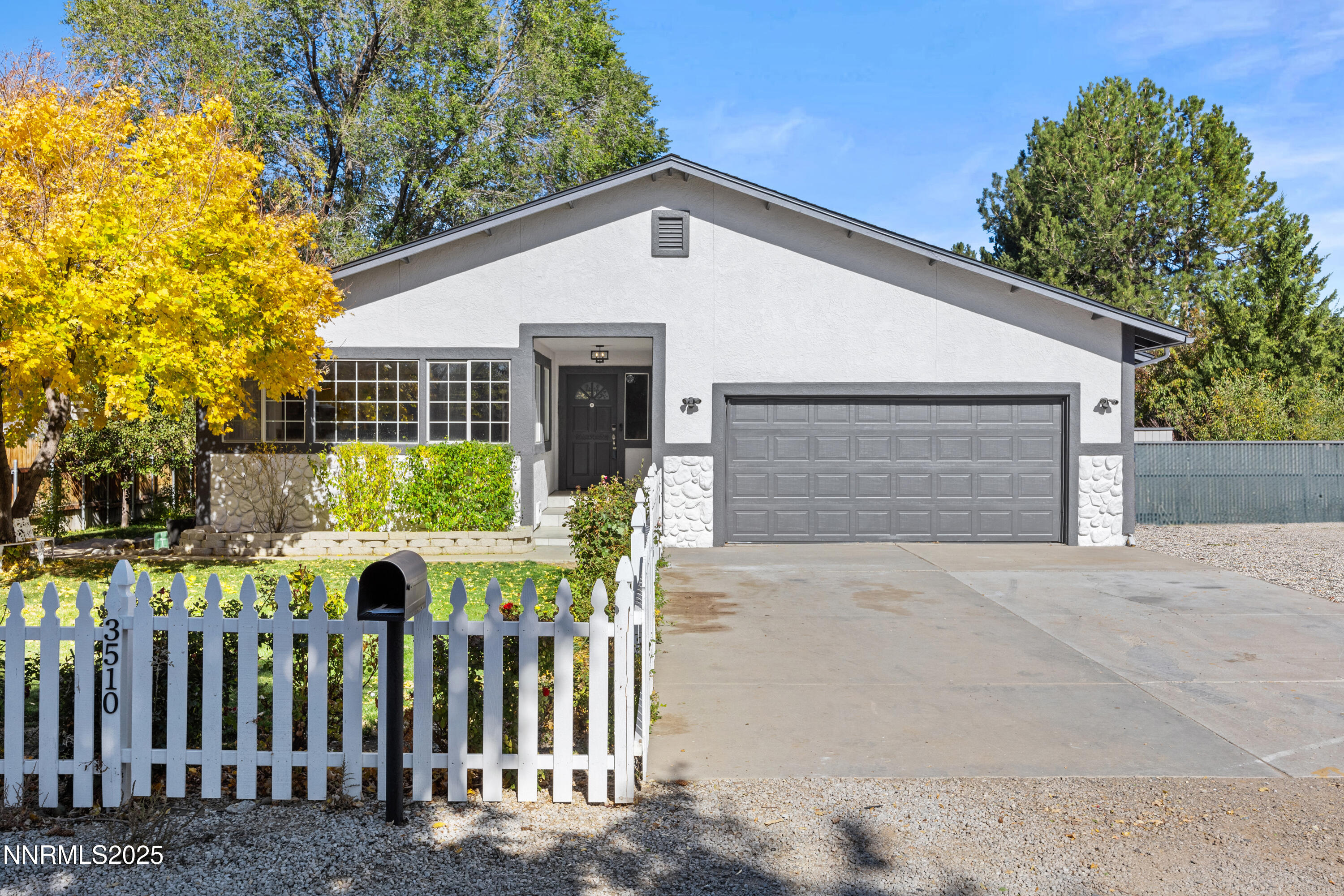 3510 Comstock Drive Reno, NV 89512 - Photo 2 of 37 a front view of house with yard and trees in the background