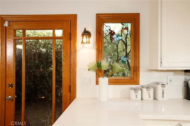 a bathroom with a window shower and a sink