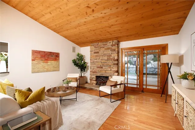 a living room with furniture city view and large windows