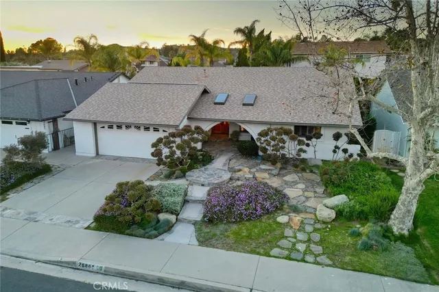an aerial view of a house with a garden