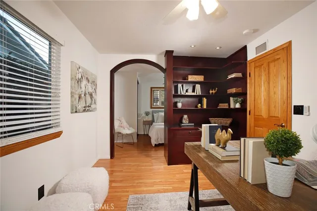 a living room with furniture and a potted plant