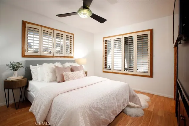 a bedroom with a large bed and a window