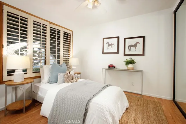 a bedroom with a bed and a table