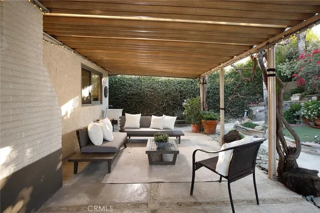 a outdoor living space with patio furniture and garden view