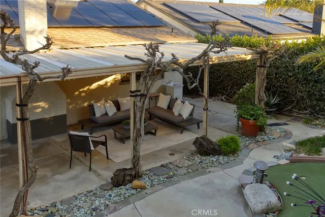 a view of a chairs and table in patio