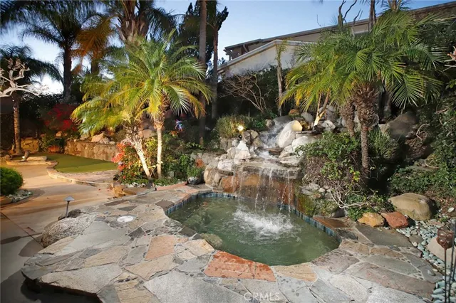 a view of a backyard with a patio and dining space