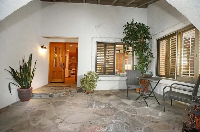 a view of a lobby with furniture and a window
