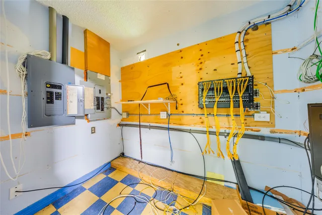 a bedroom with a bed and a mirror