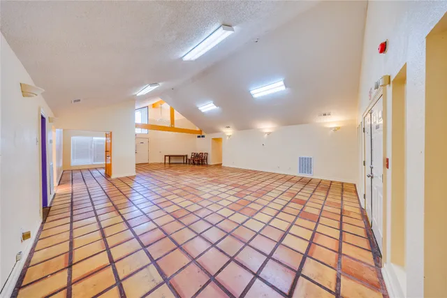 a view of a hall with an entryway