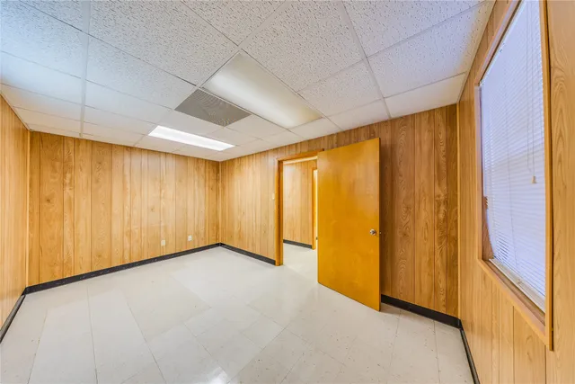 a view of a hallway to the house and chandelier