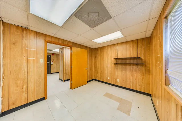 a bathroom with a sink and mirror with toilet