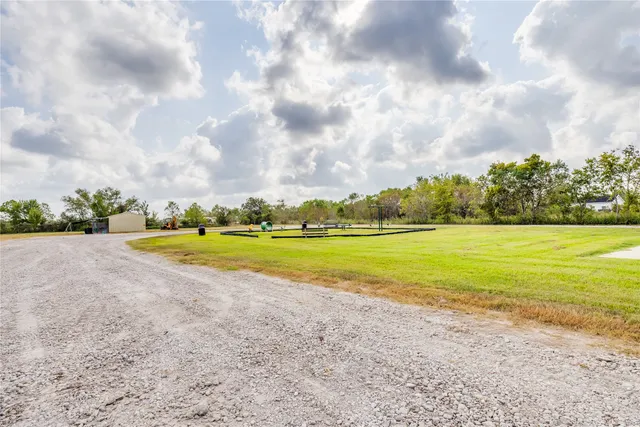 a view of an swimming pool and a yard
